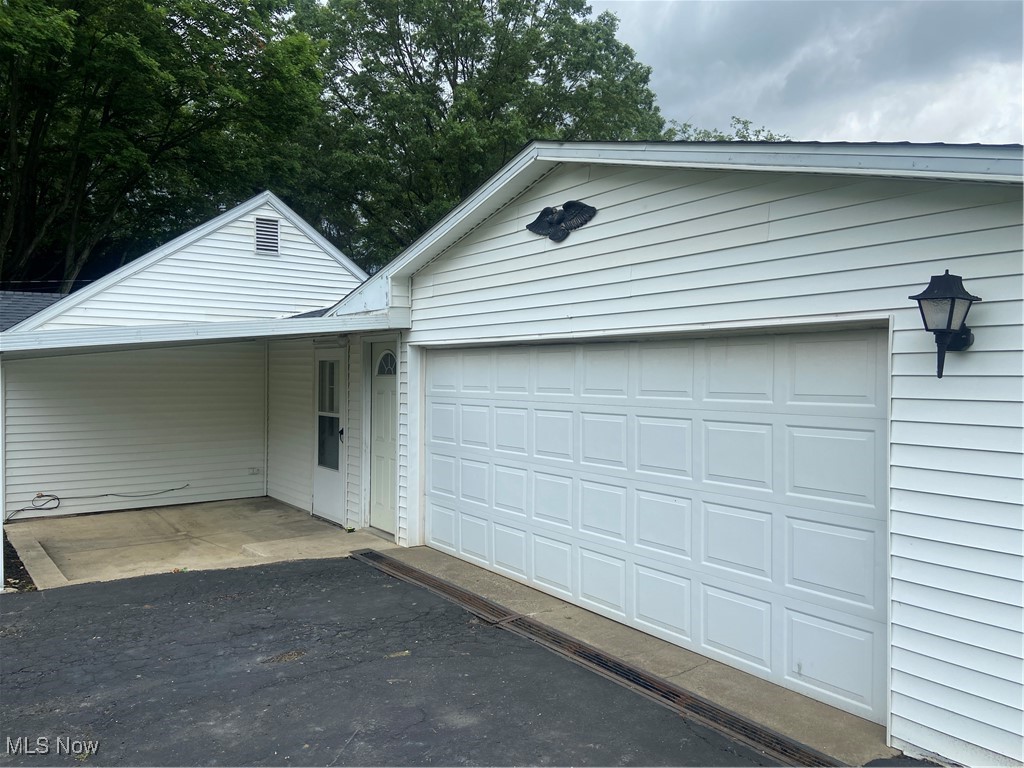 14092 Hatfield Road Rittman, OH 44270 - Photo 4 of 38 Garage featuring asphalt driveway