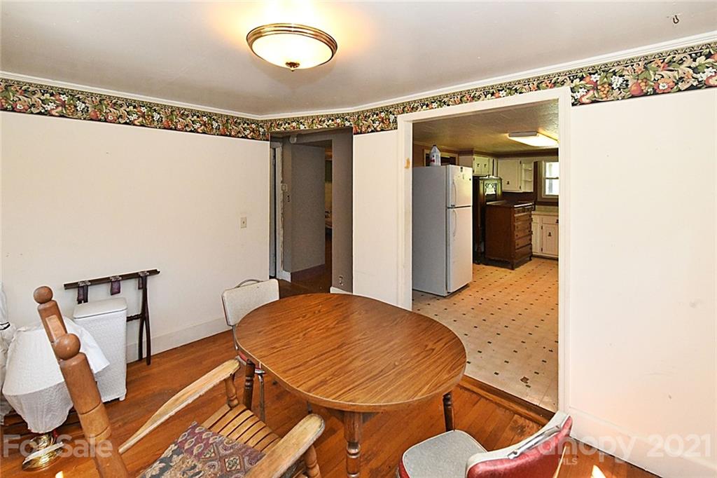 479 Joe Hampton Road Lansing, NC 28643 - Photo 11 of 44 a balcony with table and chairs