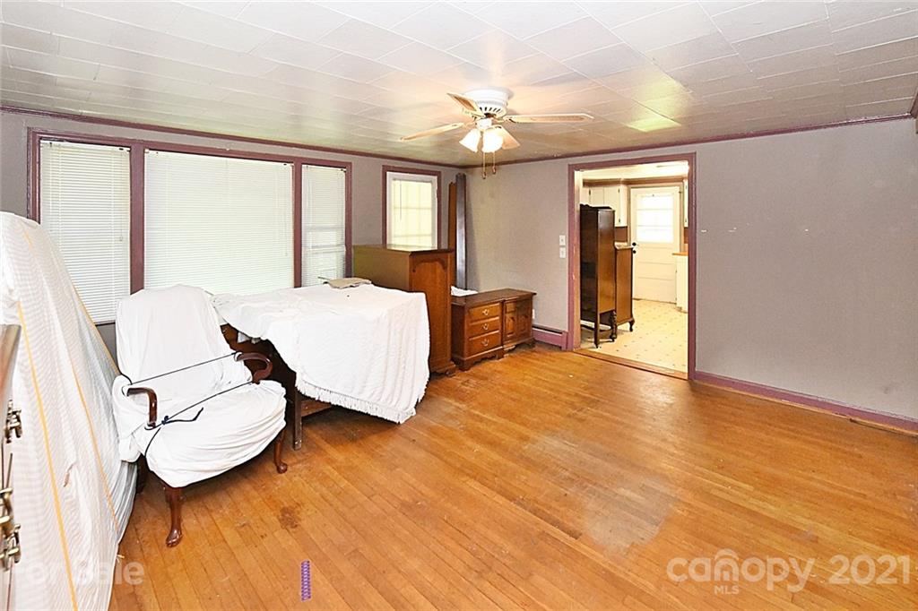 479 Joe Hampton Road Lansing, NC 28643 - Photo 23 of 44 a spacious bedroom with a bed and window