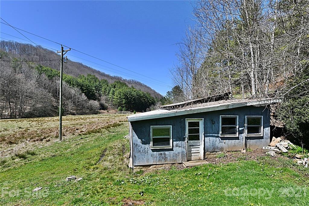 479 Joe Hampton Road Lansing, NC 28643 - Photo 27 of 44 a view of a house with a yard