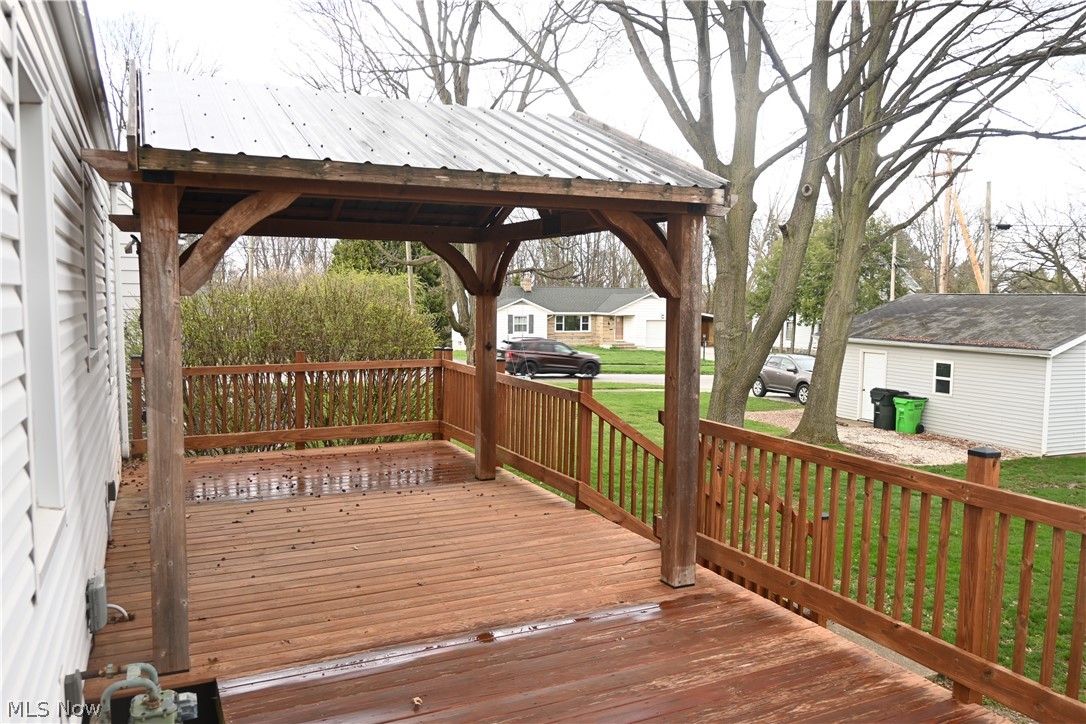 94 North 5th Street Rittman, OH 44270 - Photo 21 of 27 Wooden deck featuring a residential view and a yard