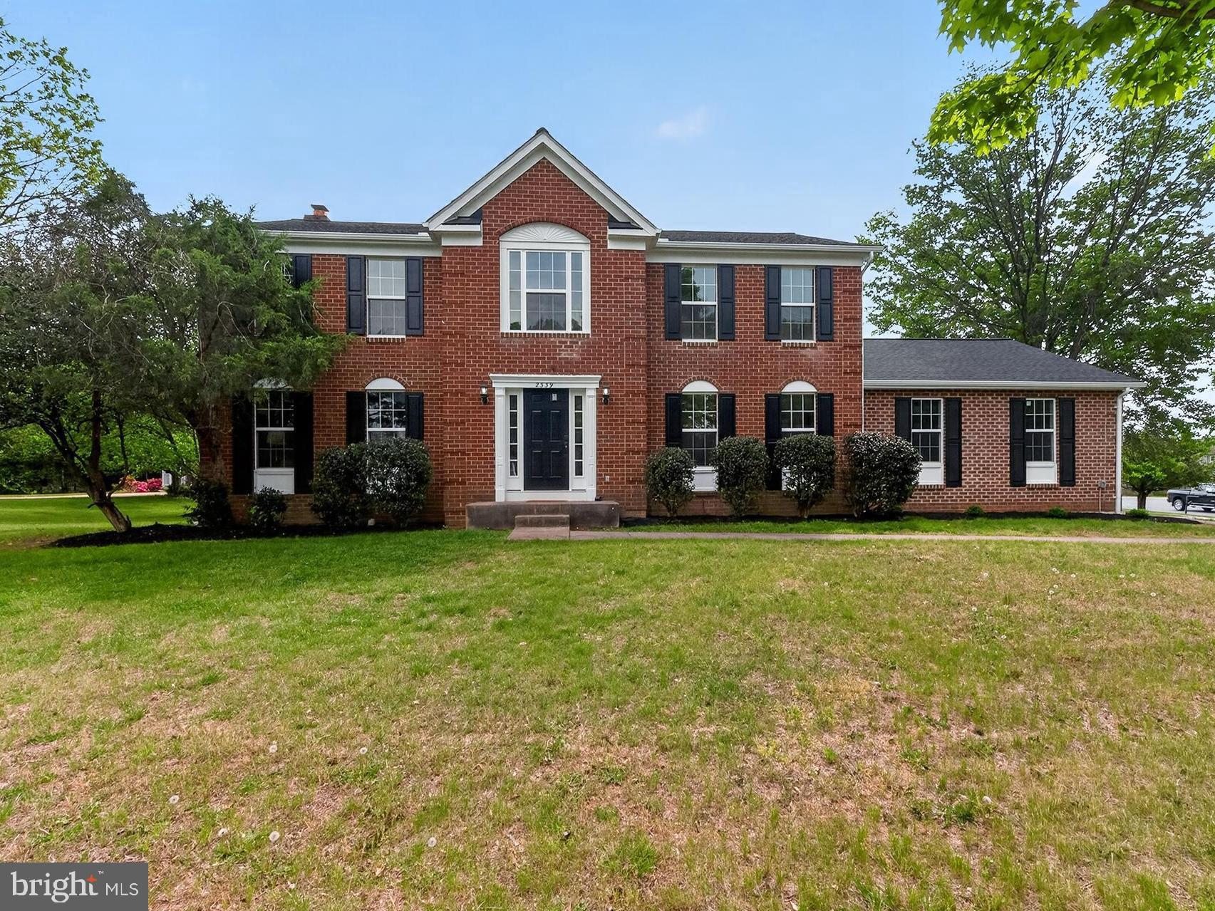 2339 Colts Brook Drive Reston, VA 20191 - Photo 1 of 51 a front view of a house with a garden