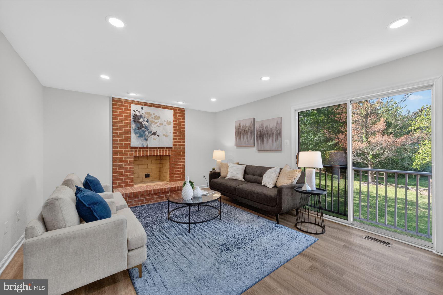 2339 Colts Brook Drive Reston, VA 20191 - Photo 12 of 51 a living room with furniture and a floor to ceiling window
