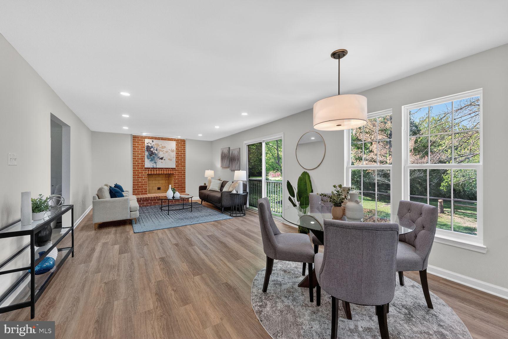 2339 Colts Brook Drive Reston, VA 20191 - Photo 14 of 51 a living room with furniture chandelier and a large window