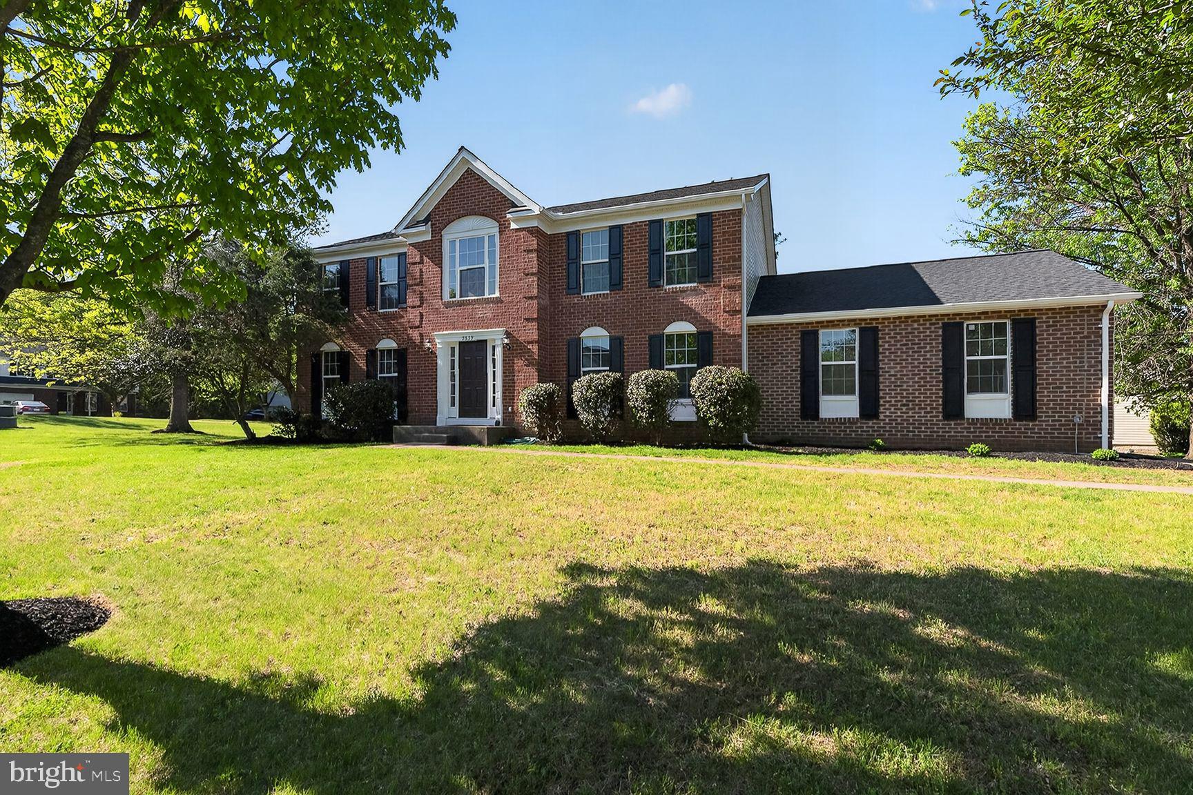 2339 Colts Brook Drive Reston, VA 20191 - Photo 2 of 51 a front view of house with yard and swimming pool