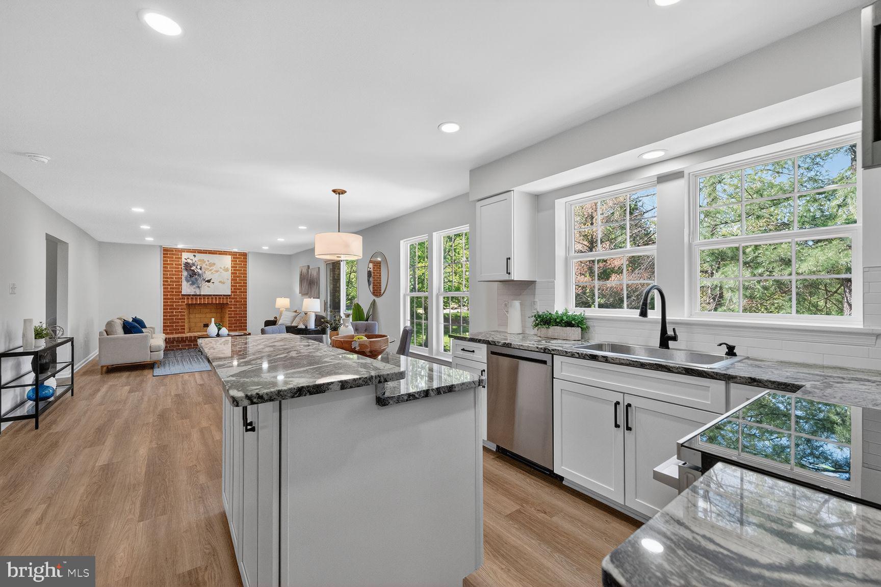 2339 Colts Brook Drive Reston, VA 20191 - Photo 21 of 51 a kitchen with a sink stove and cabinets