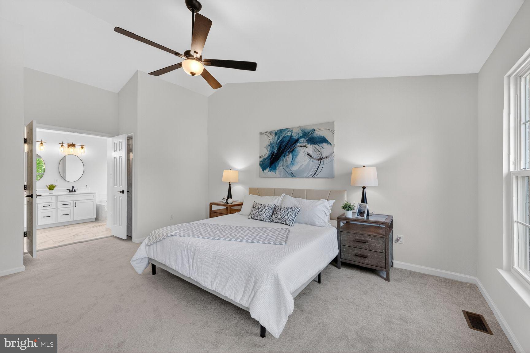 2339 Colts Brook Drive Reston, VA 20191 - Photo 26 of 51 a bedroom with a bed and a chandelier