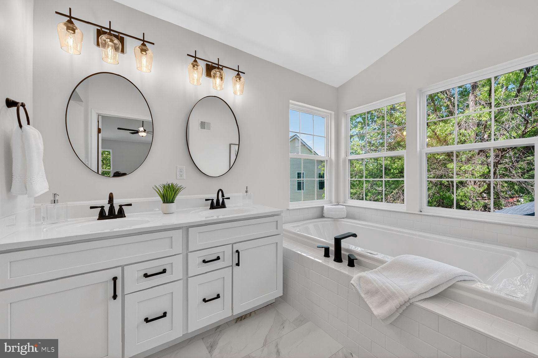 2339 Colts Brook Drive Reston, VA 20191 - Photo 30 of 51 a en suite bathroom with a granite countertop double vanity sink and a large mirror