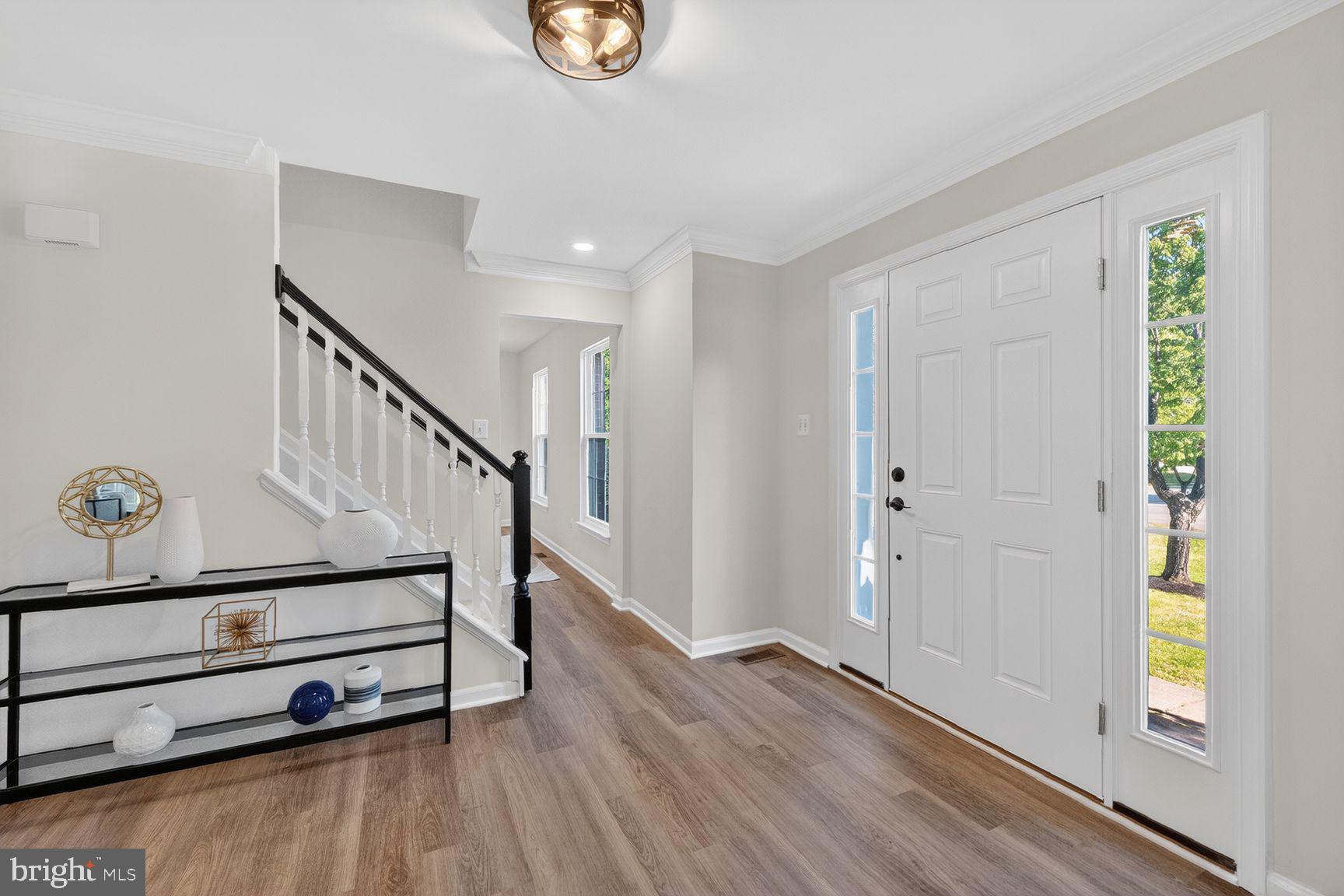 2339 Colts Brook Drive Reston, VA 20191 - Photo 3 of 51 a view of entryway with wooden floor and stairs