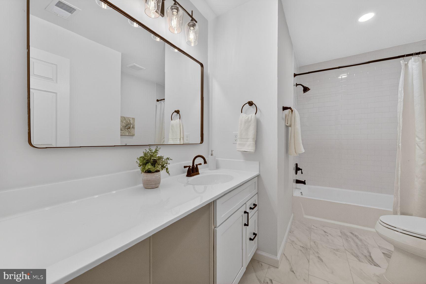 2339 Colts Brook Drive Reston, VA 20191 - Photo 34 of 51 a bathroom with a sink a toilet and shower