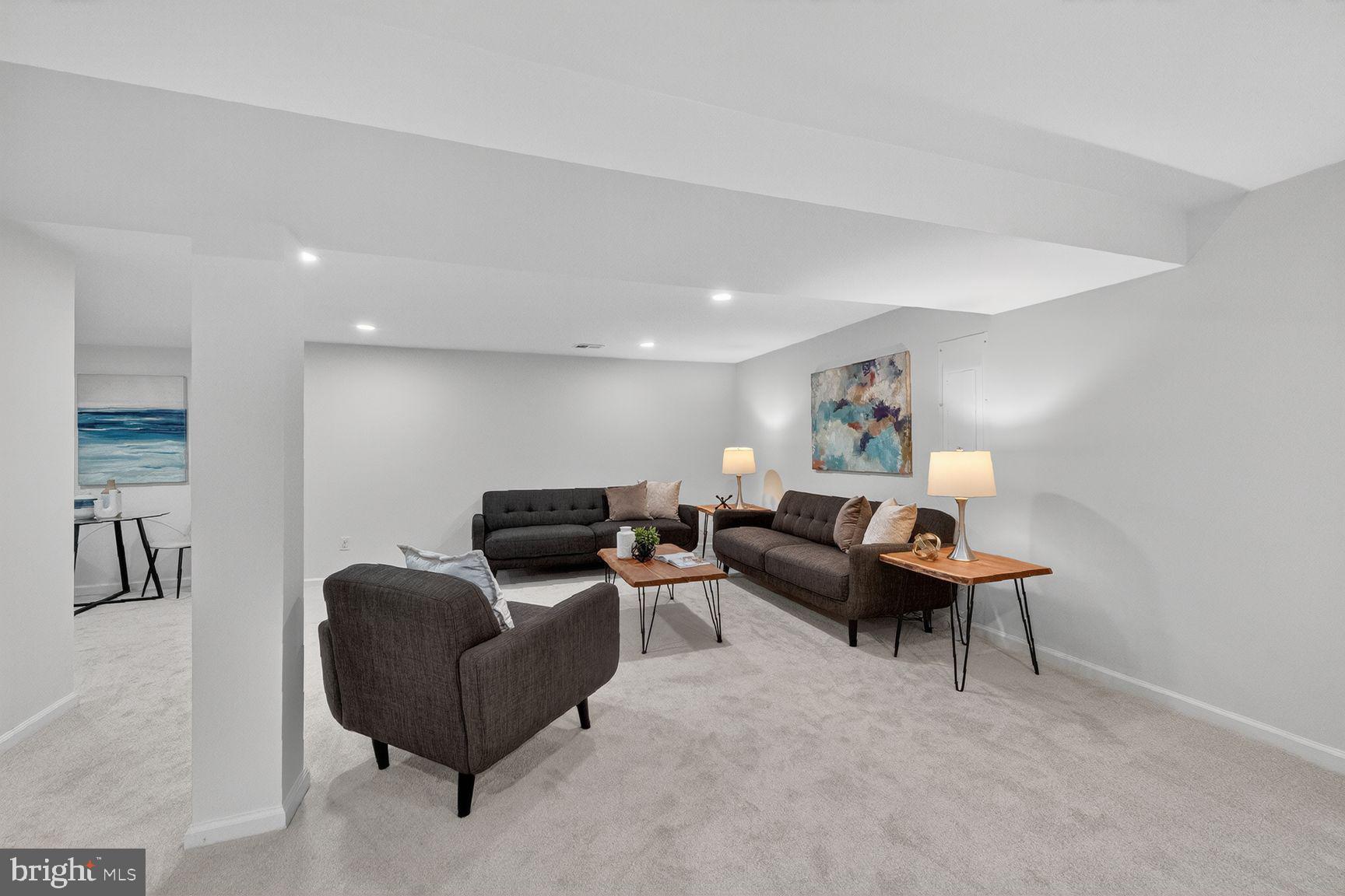 2339 Colts Brook Drive Reston, VA 20191 - Photo 40 of 51 a living room with furniture and a flat screen tv