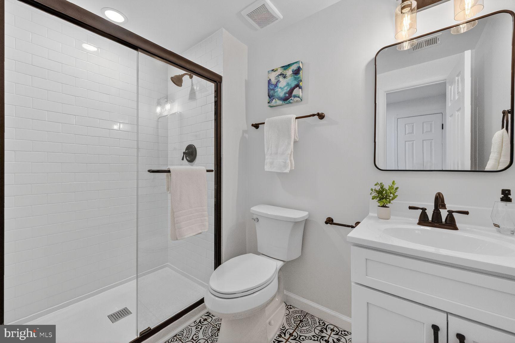 2339 Colts Brook Drive Reston, VA 20191 - Photo 45 of 51 a bathroom with a toilet sink and shower