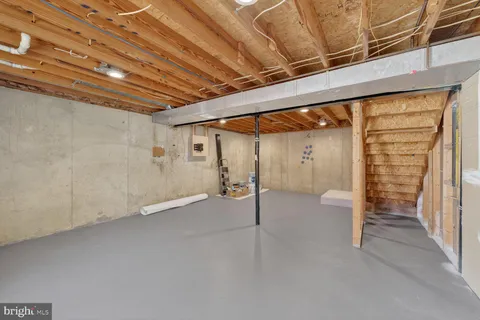 a view of an empty room with wooden walls