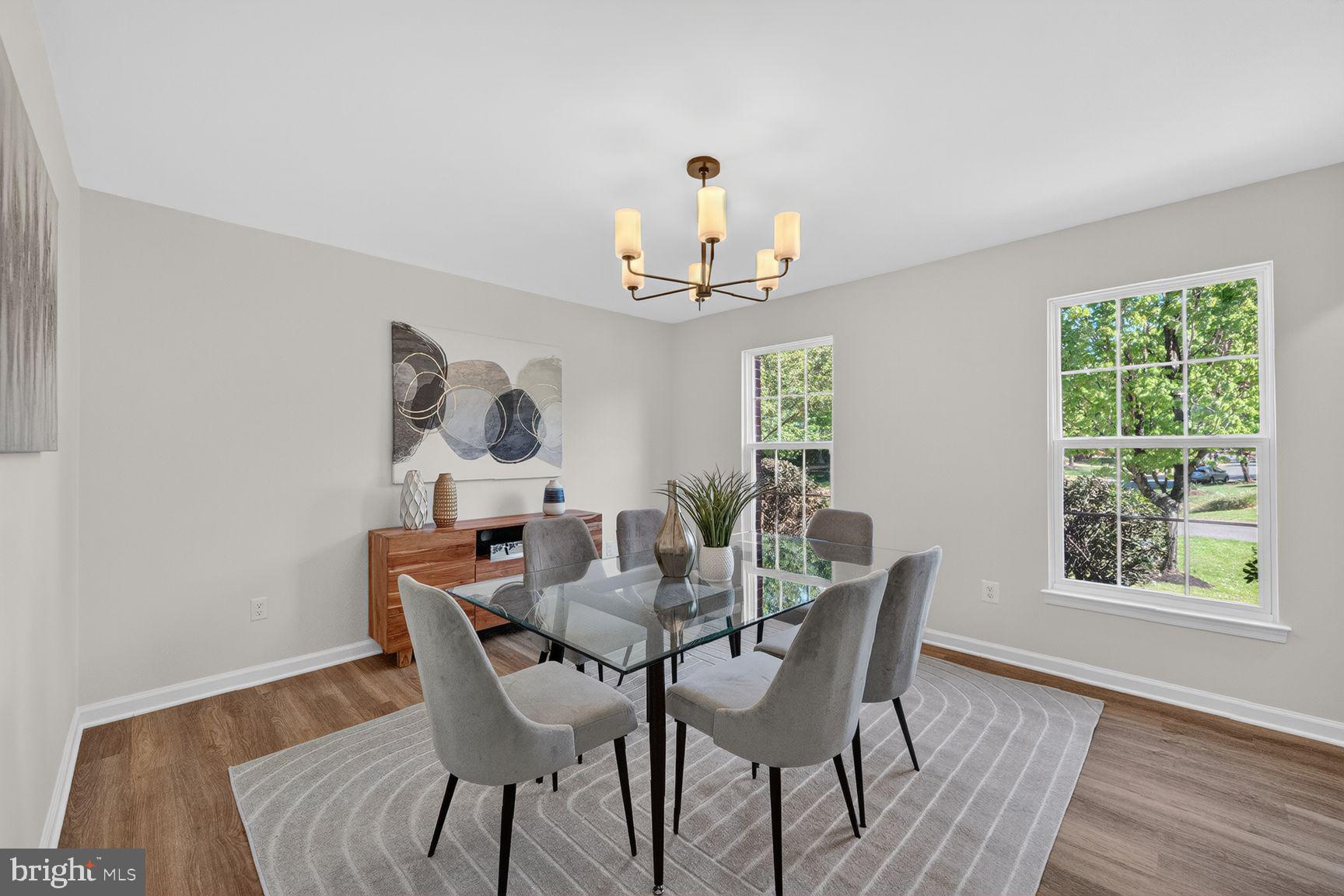 2339 Colts Brook Drive Reston, VA 20191 - Photo 9 of 51 a view of a dining room with furniture a potted plant and wooden floor