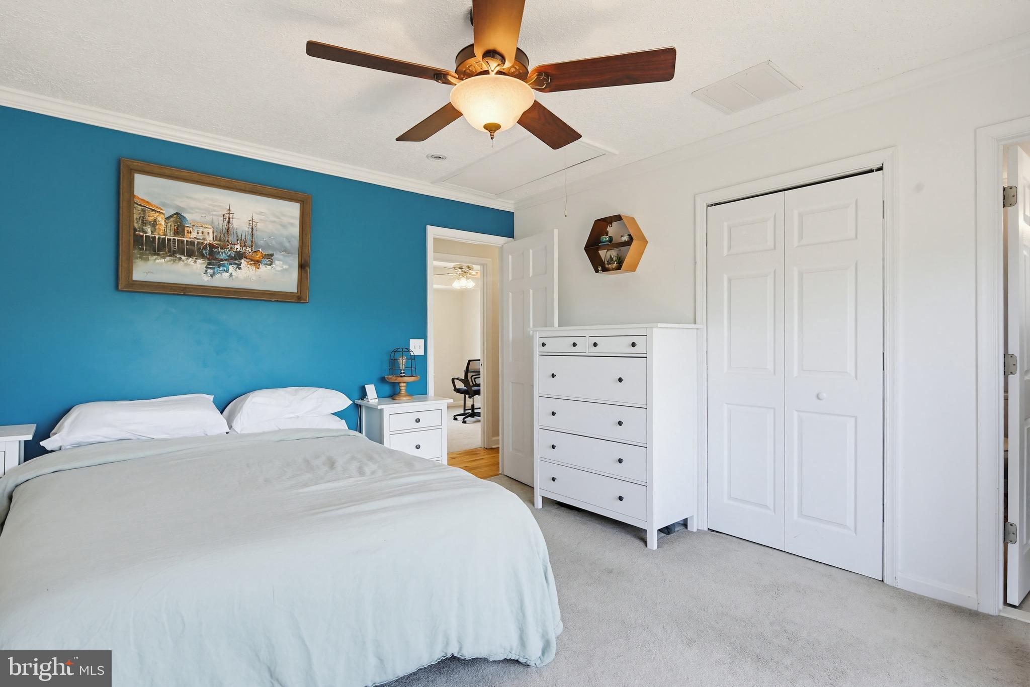 3229 Beards Point Road Davidsonville, MD 21035 - Photo 51 of 69 a bedroom with a bed and a dresser