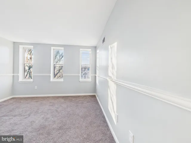 a view of staircase with white walls