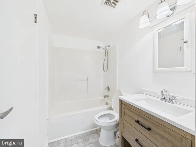 a row of white building with a lot of windows