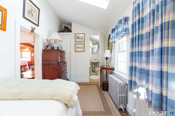 a bedroom with a bed and a cabinets