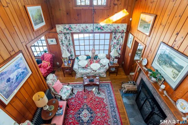 a living room with furniture and a rug