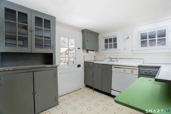 a kitchen with a cabinets and a sink
