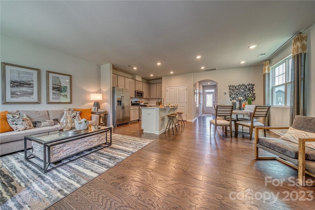 6017 Chelsea Oaks Ridge, Unit 2086 Tega Cay, SC 29708 - Photo 2 of 12 a living room with furniture and a table