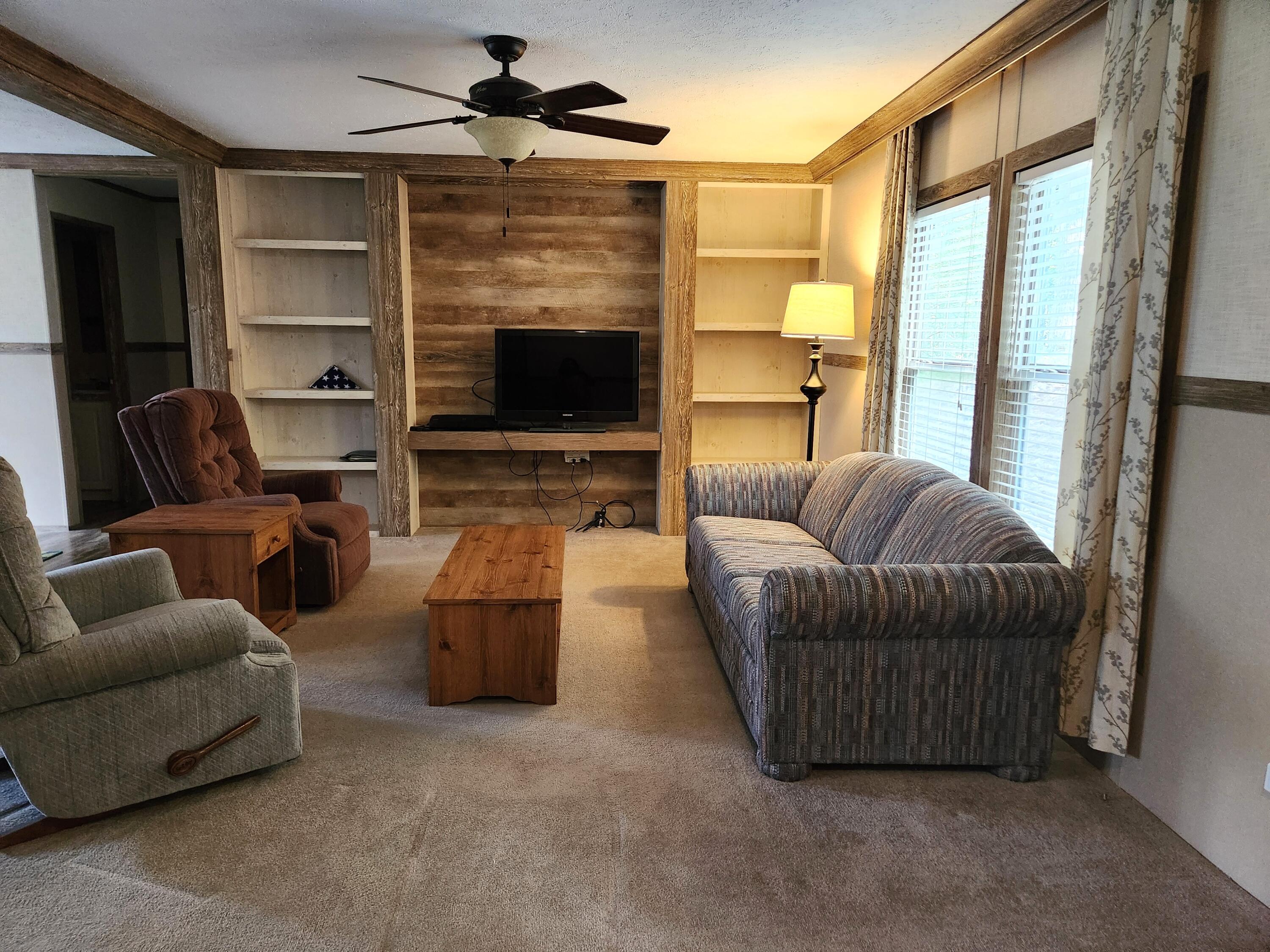 300 Whisperway Road Moneta, VA 24121 - Photo 11 of 24 a living room with furniture and a flat screen tv
