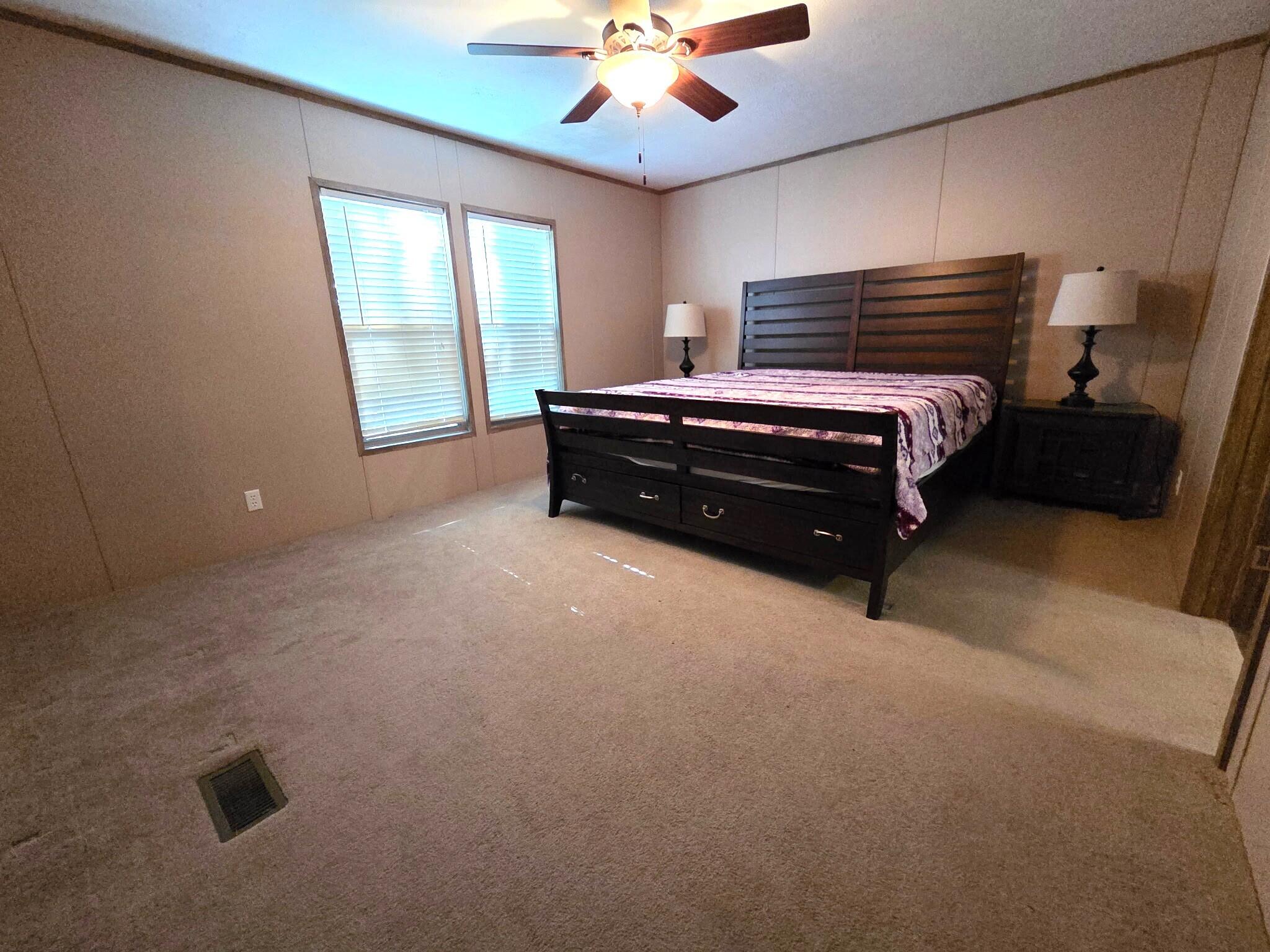 300 Whisperway Road Moneta, VA 24121 - Photo 12 of 24 a room with a bed and a chandelier