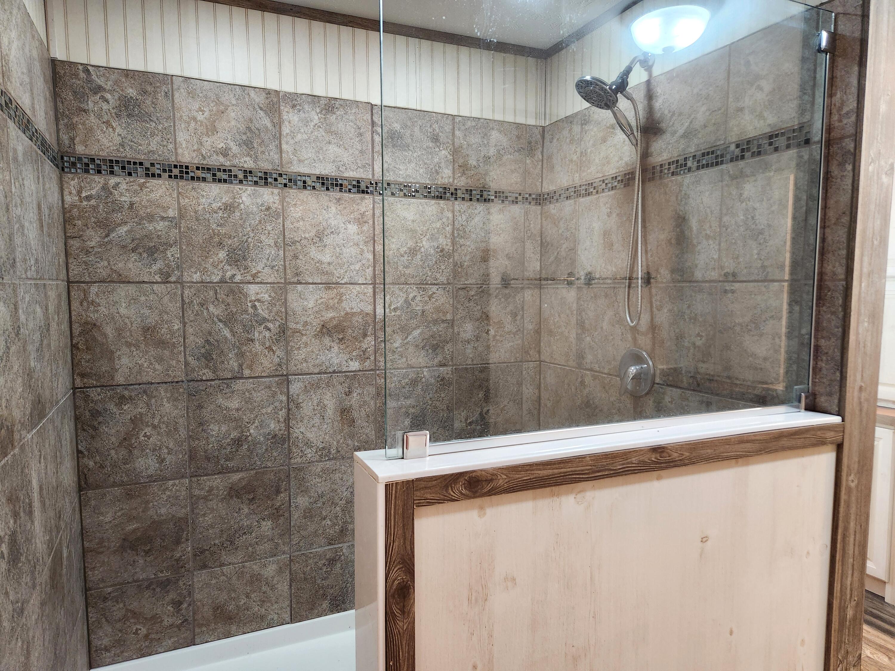 300 Whisperway Road Moneta, VA 24121 - Photo 15 of 24 a bathroom with a shower and a sink
