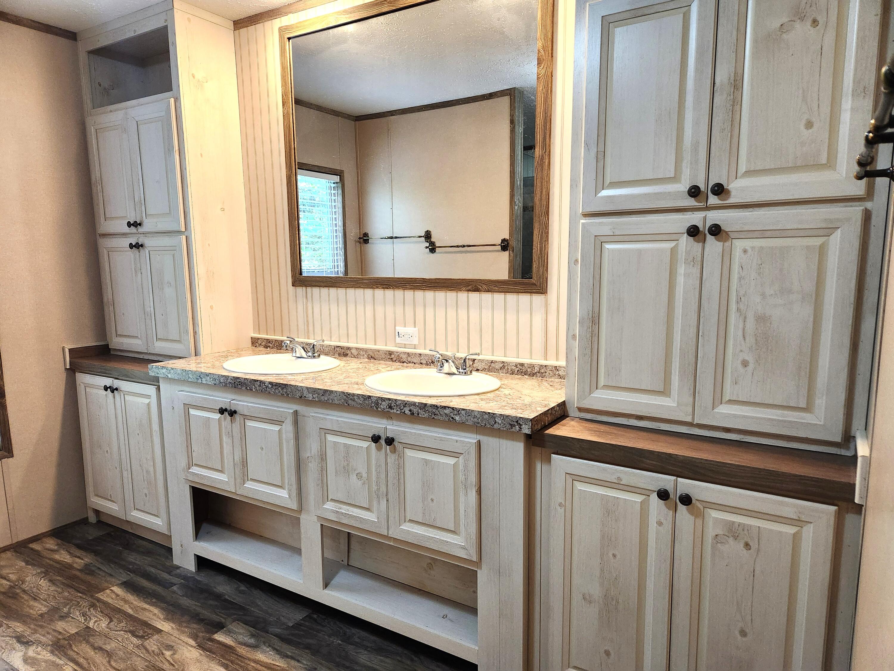 300 Whisperway Road Moneta, VA 24121 - Photo 16 of 24 a bathroom with a sink and a mirror