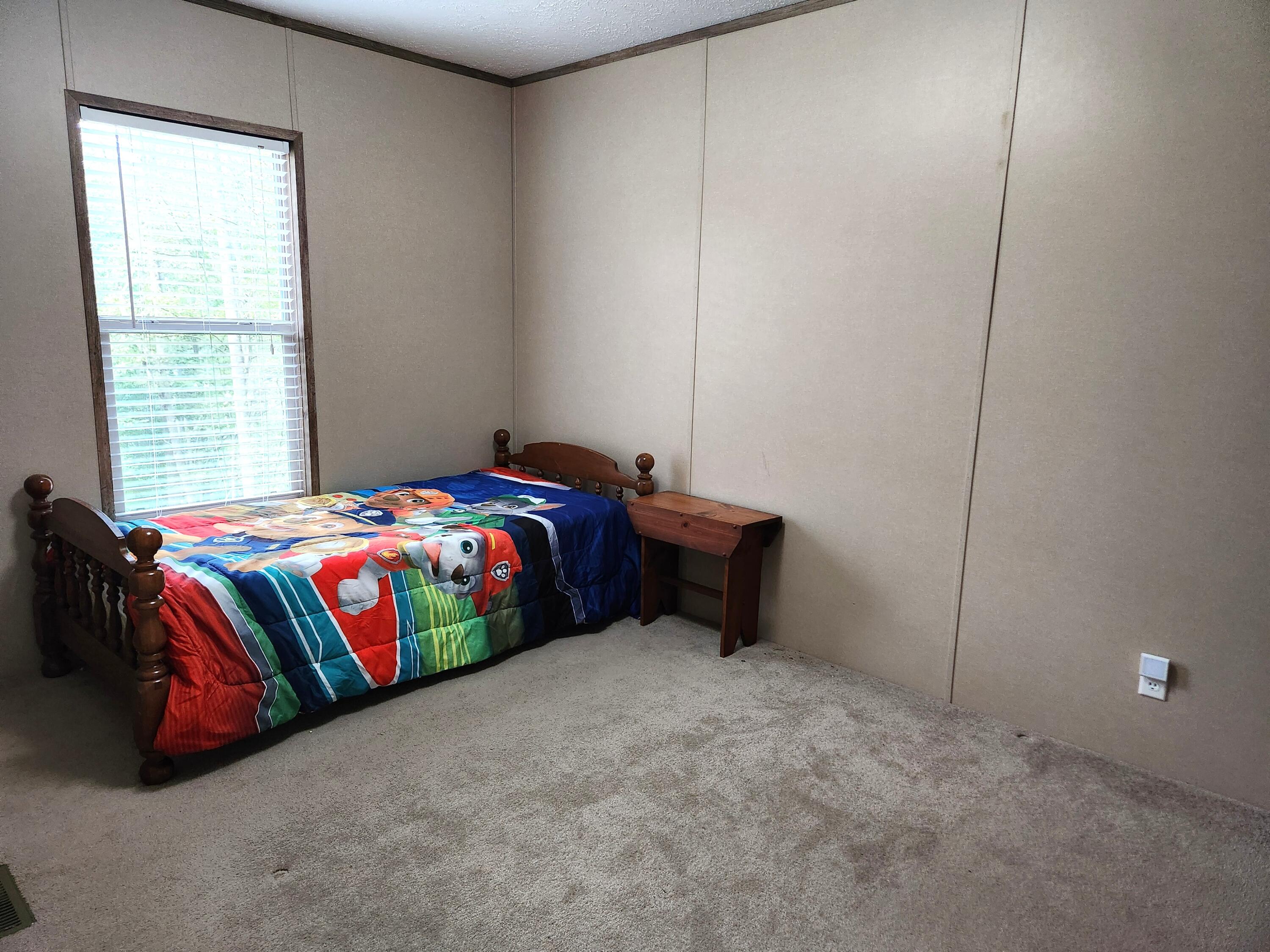 300 Whisperway Road Moneta, VA 24121 - Photo 17 of 24 a bedroom with a bed and a window