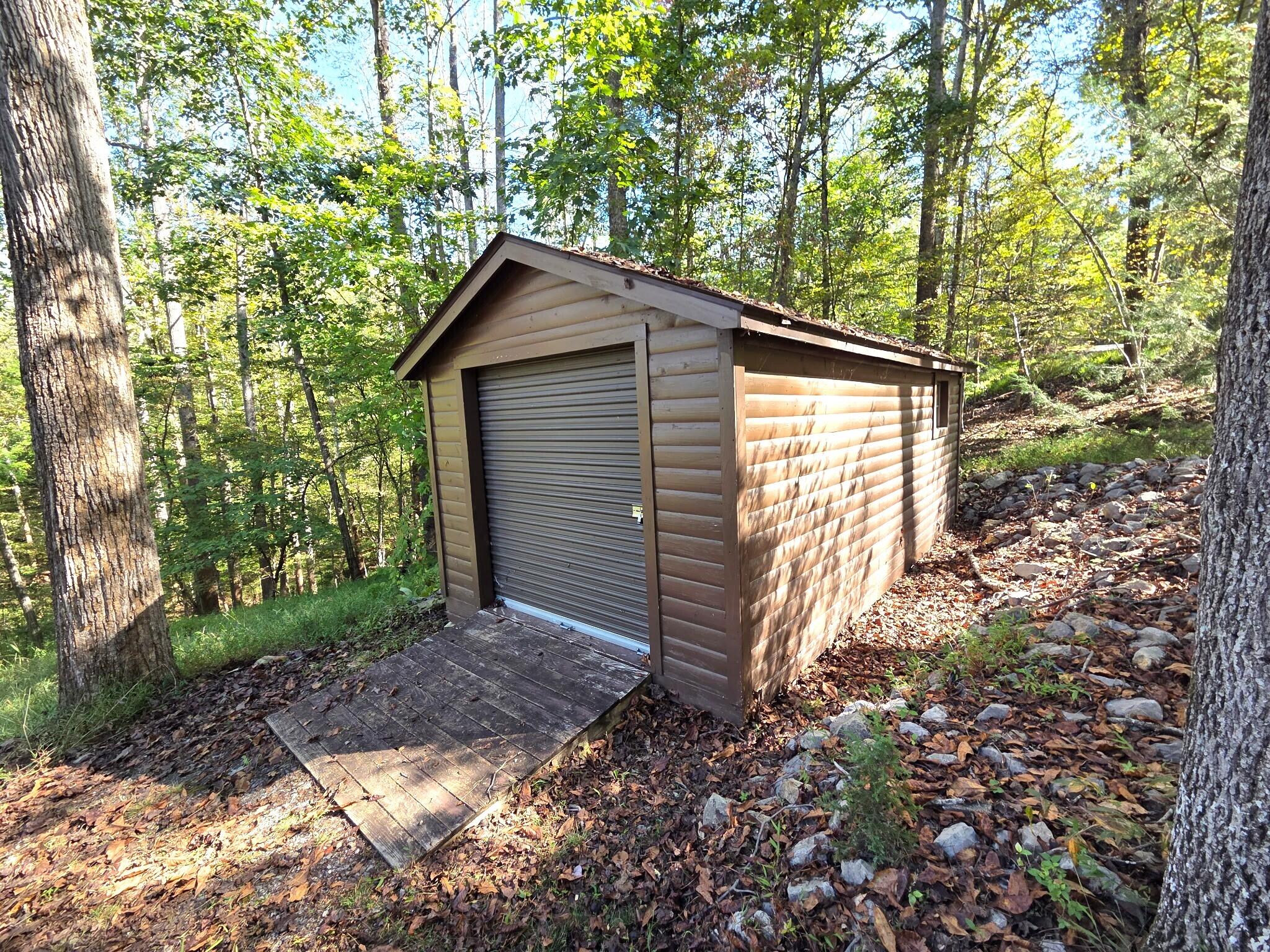300 Whisperway Road Moneta, VA 24121 - Photo 22 of 24 a backyard of a house with lots of green space