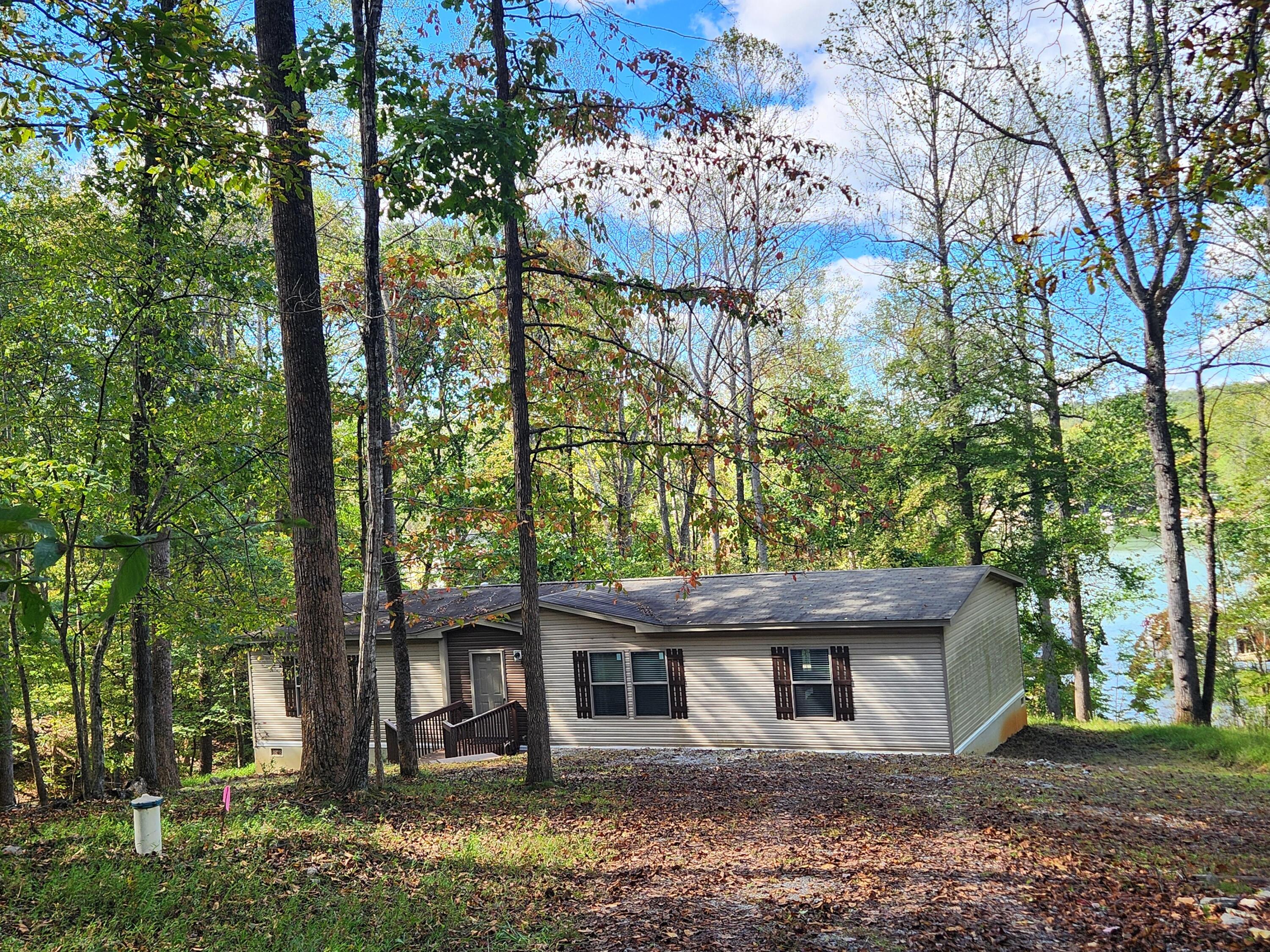 300 Whisperway Road Moneta, VA 24121 - Photo 24 of 24 front view of a house with a tree