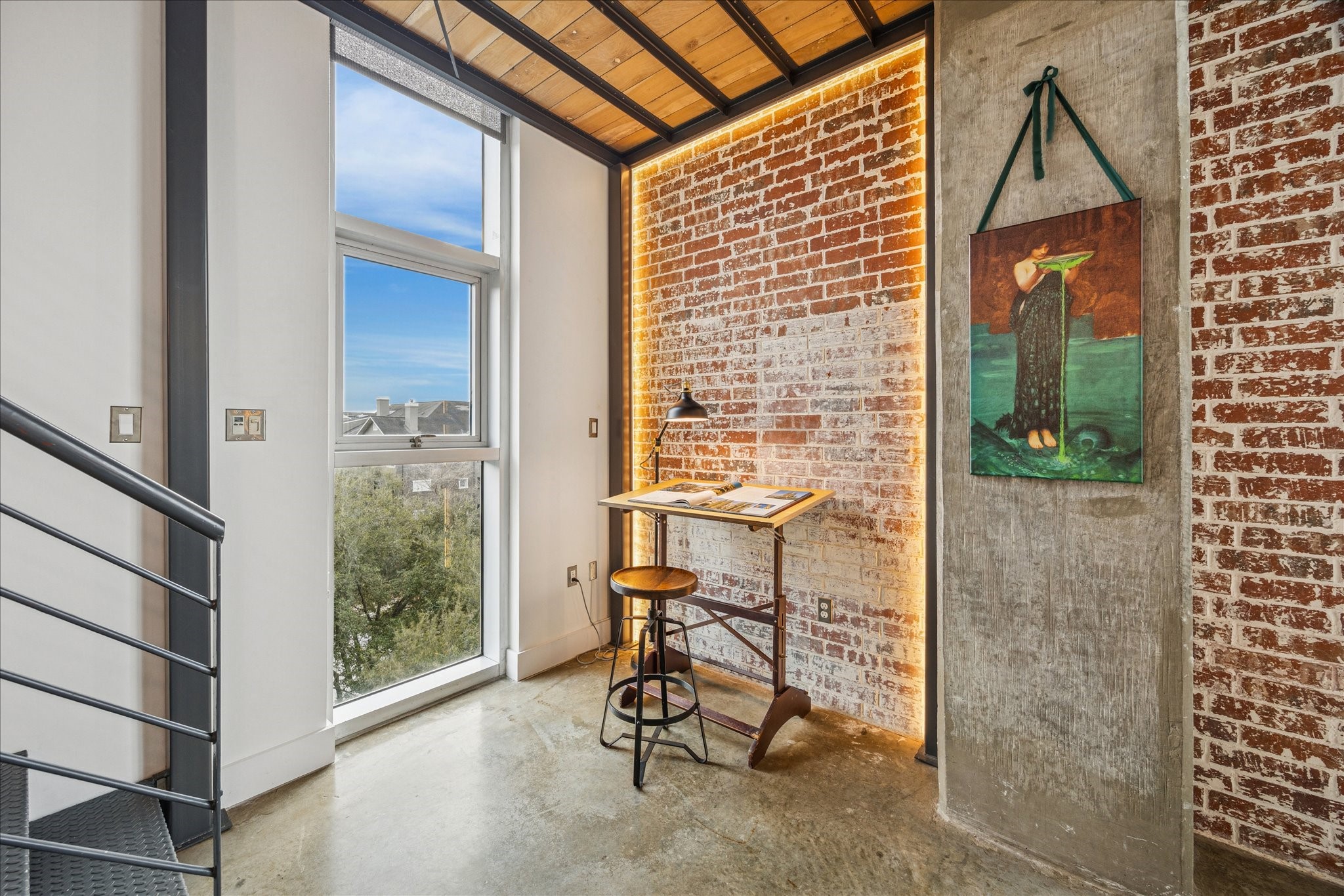 2000 Bagby Street, Unit 5400 Houston, TX 77002 - Photo 10 of 47 Small work/reading area with wall-mounted LED lighting and a brick-look accent wall.