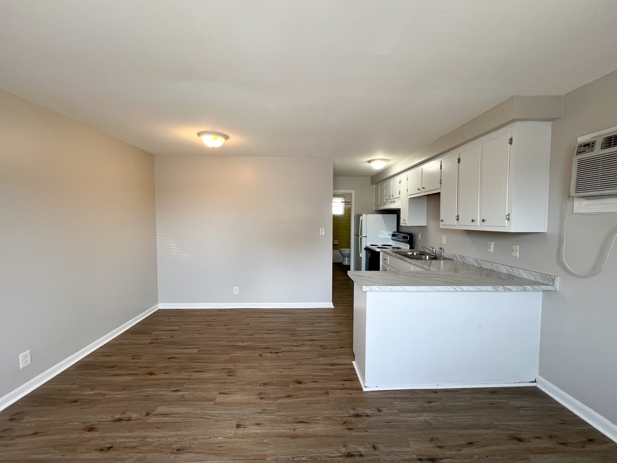 701 Power Street, Unit 4 Clarksville, TN 37042 - Photo 3 of 10 a view of kitchen with wooden floor