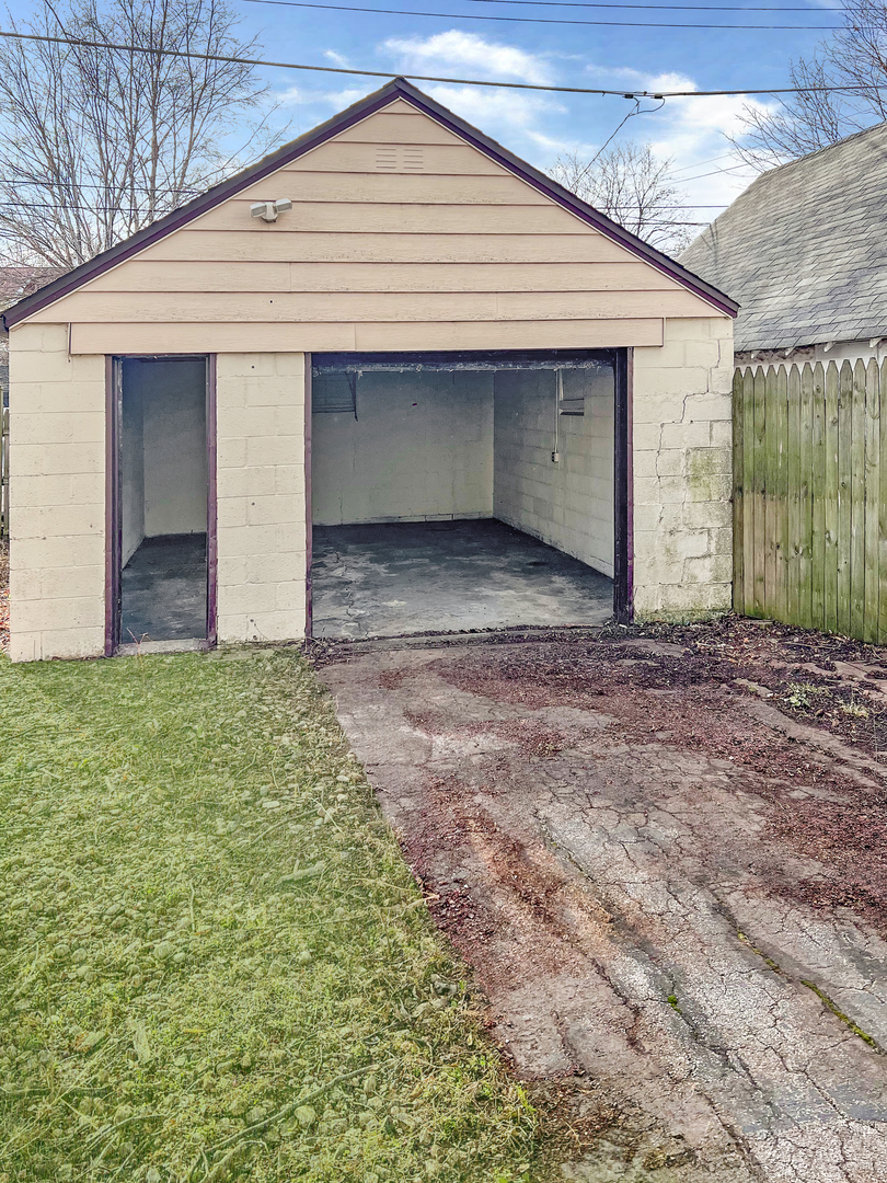 28 West 35th Place Steger, IL 60475 - Photo 20 of 20 a view of a house with a yard and garage