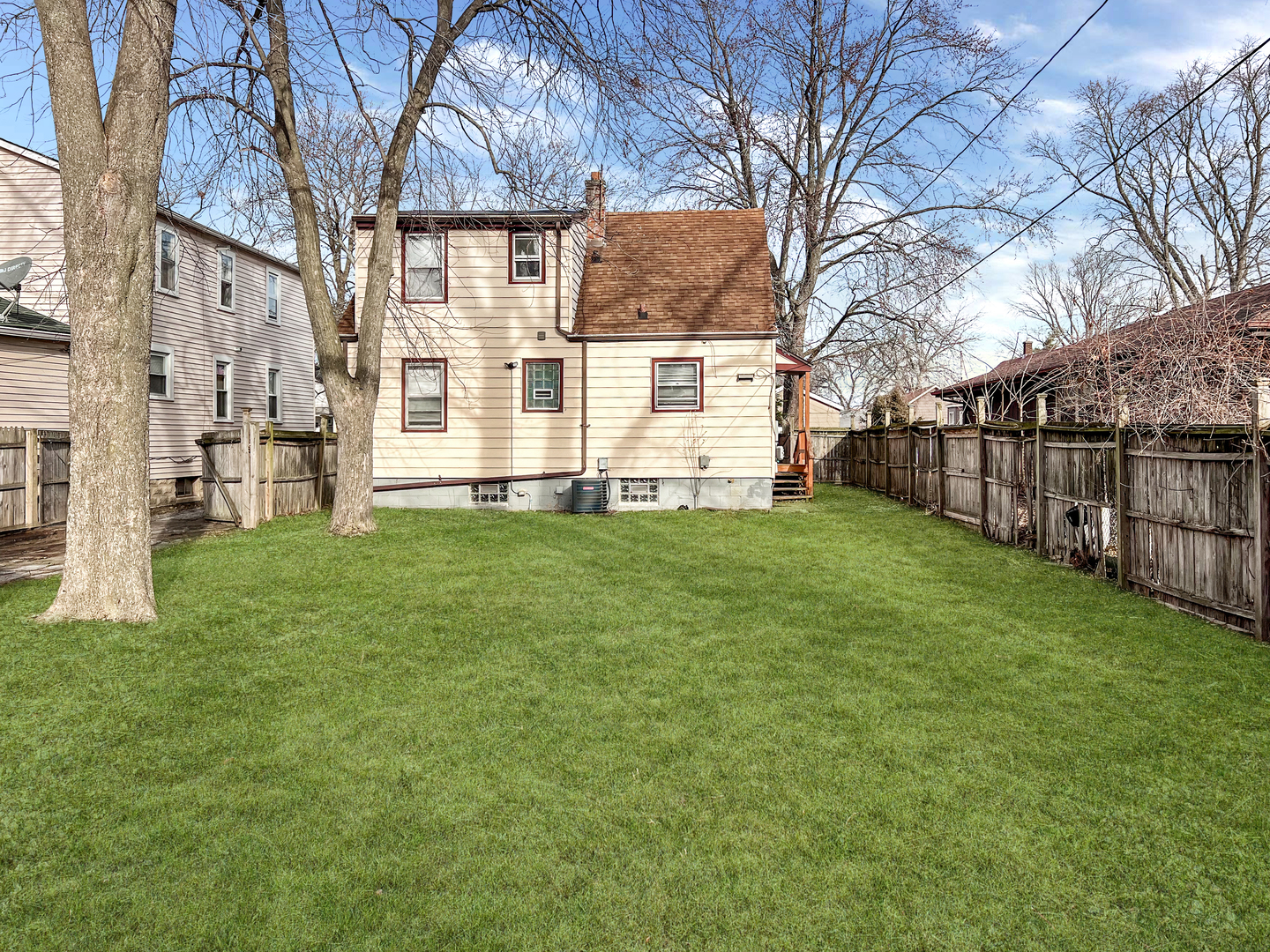28 West 35th Place Steger, IL 60475 - Photo 3 of 20 a view of a backyard with large trees