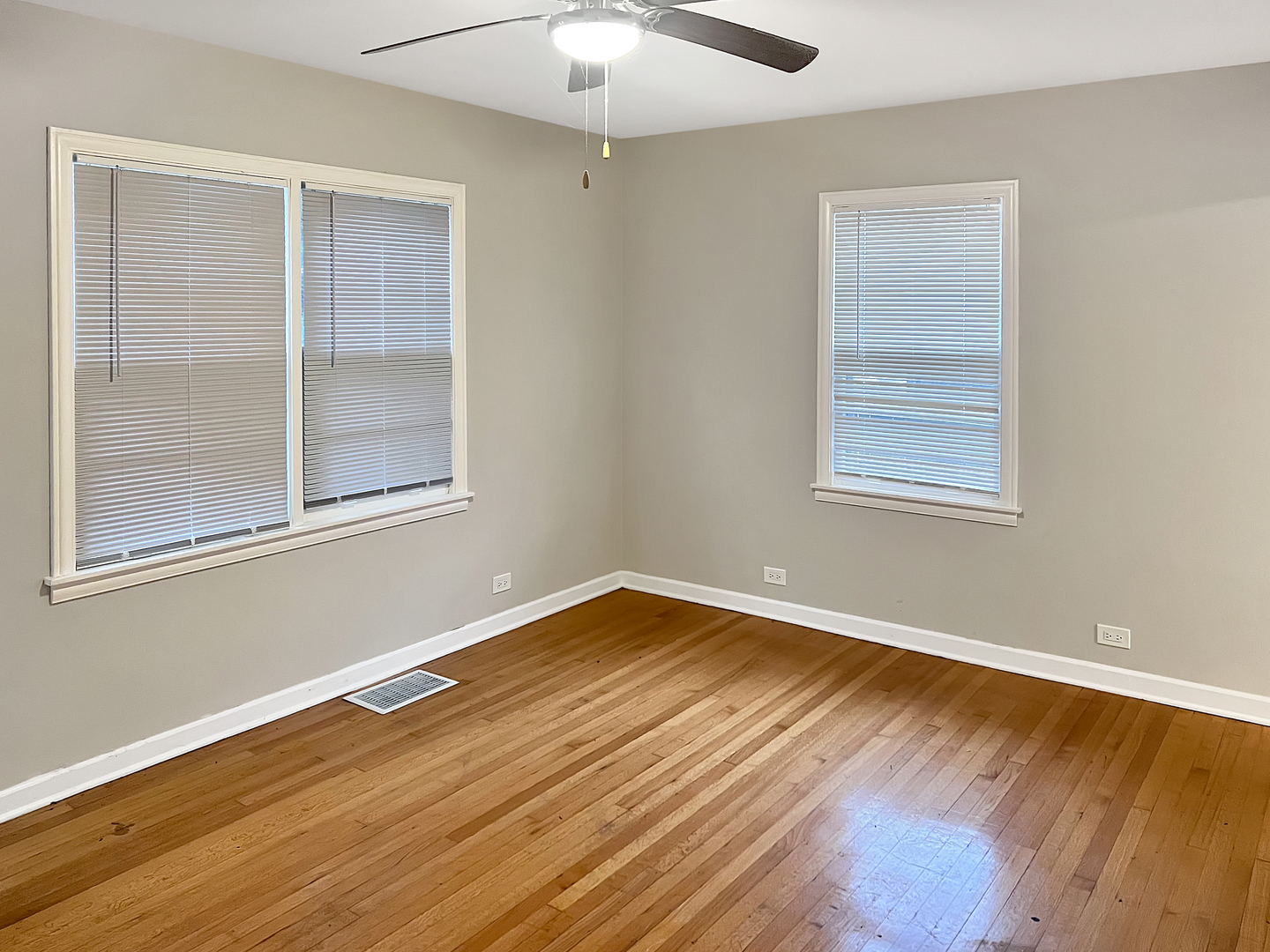 28 West 35th Place Steger, IL 60475 - Photo 9 of 20 a view of an empty room with wooden floor and a window