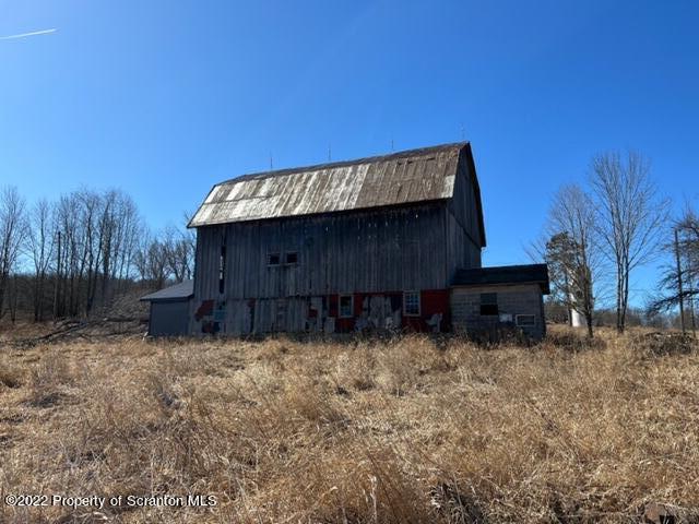 174 Upper Gelatt Road Thompson, PA 18465 - Photo 6 of 19 a view of a house with a yard
