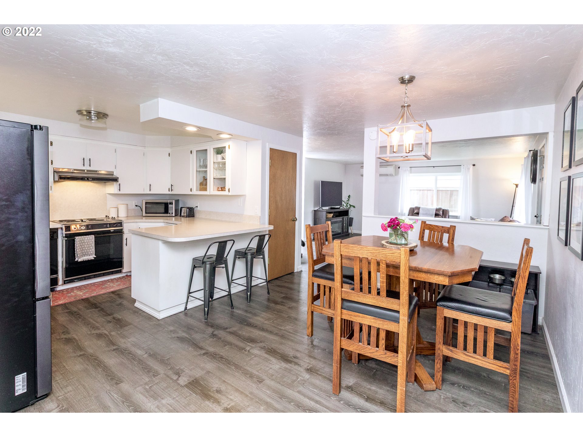 1081 South 44th Street Springfield, OR 97478 - Photo 7 of 10 a large kitchen with a table and chairs