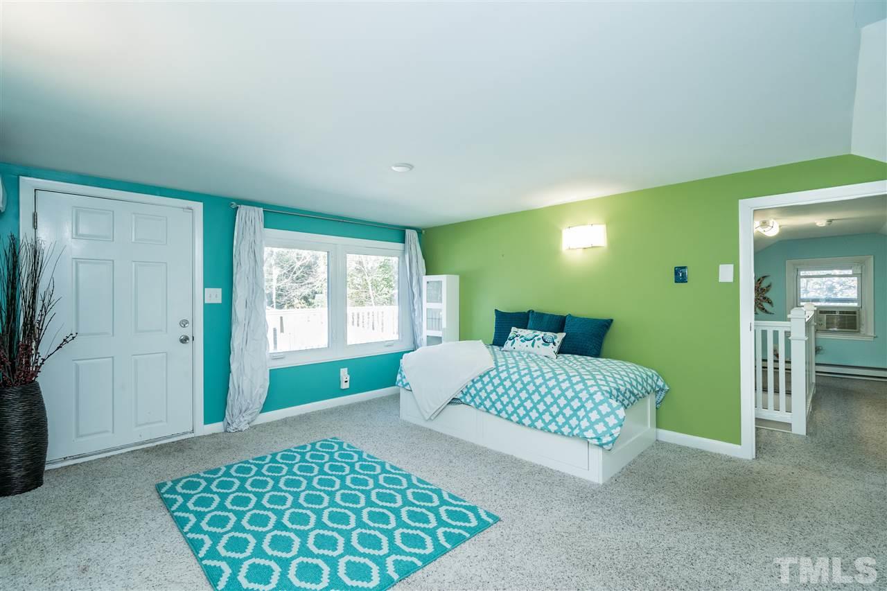 1511 Cherokee Drive Raleigh, NC 27608 - Photo 21 of 30 Another view of the large bedroom on the second floor! Excellent space but unable to count is square footage due to ceiling height. Permits unknown.