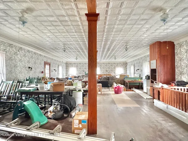 a living room with lots of furniture and a chandelier