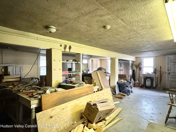 a view of a swimming pool with furniture