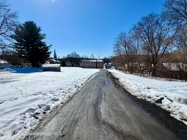 a view of snow on the road