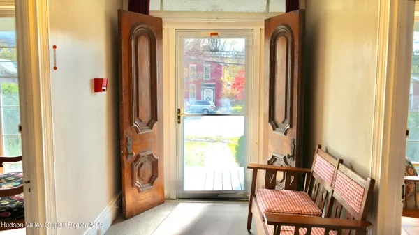 a view of a balcony with furniture and a window