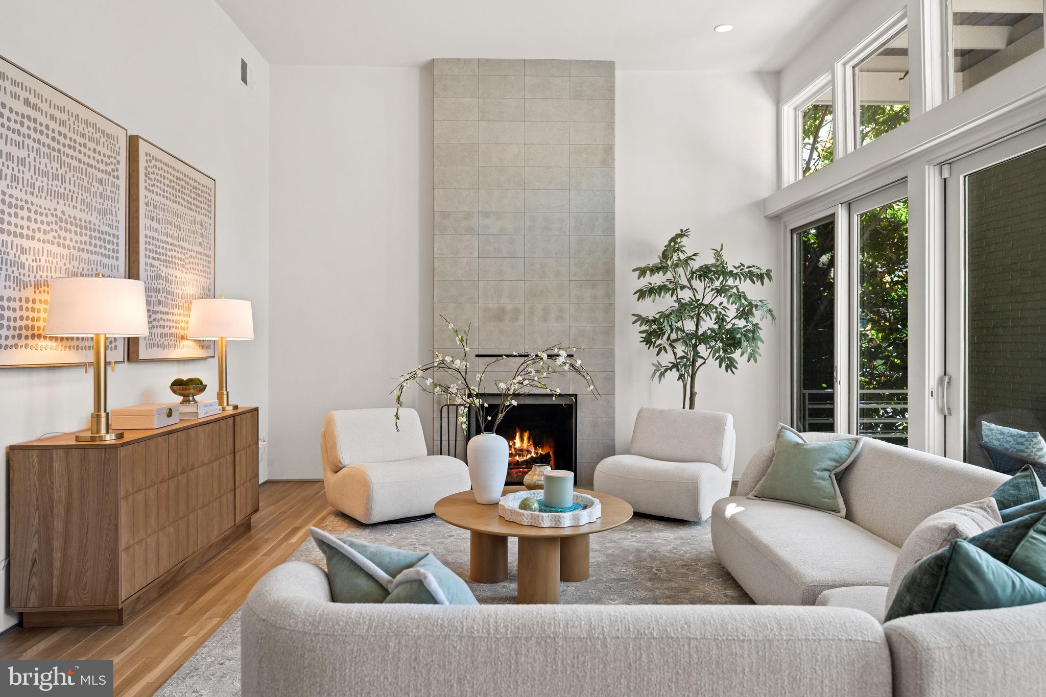 2319 Bancroft Place Northwest Washington, DC 20008 - Photo 11 of 37 a living room with furniture a fireplace and a large window