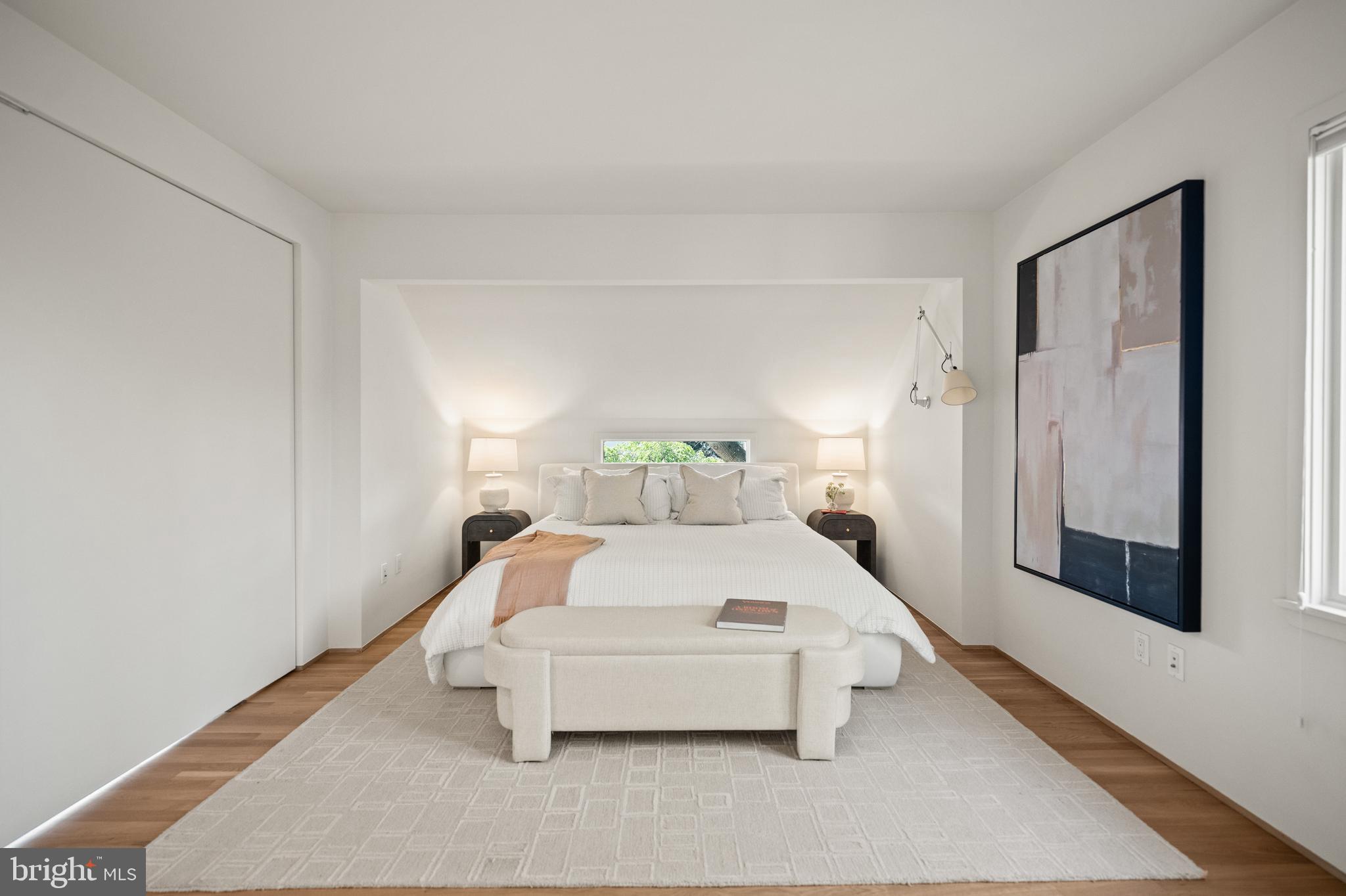 2319 Bancroft Place Northwest Washington, DC 20008 - Photo 22 of 37 a bedroom with a bed and a night stand