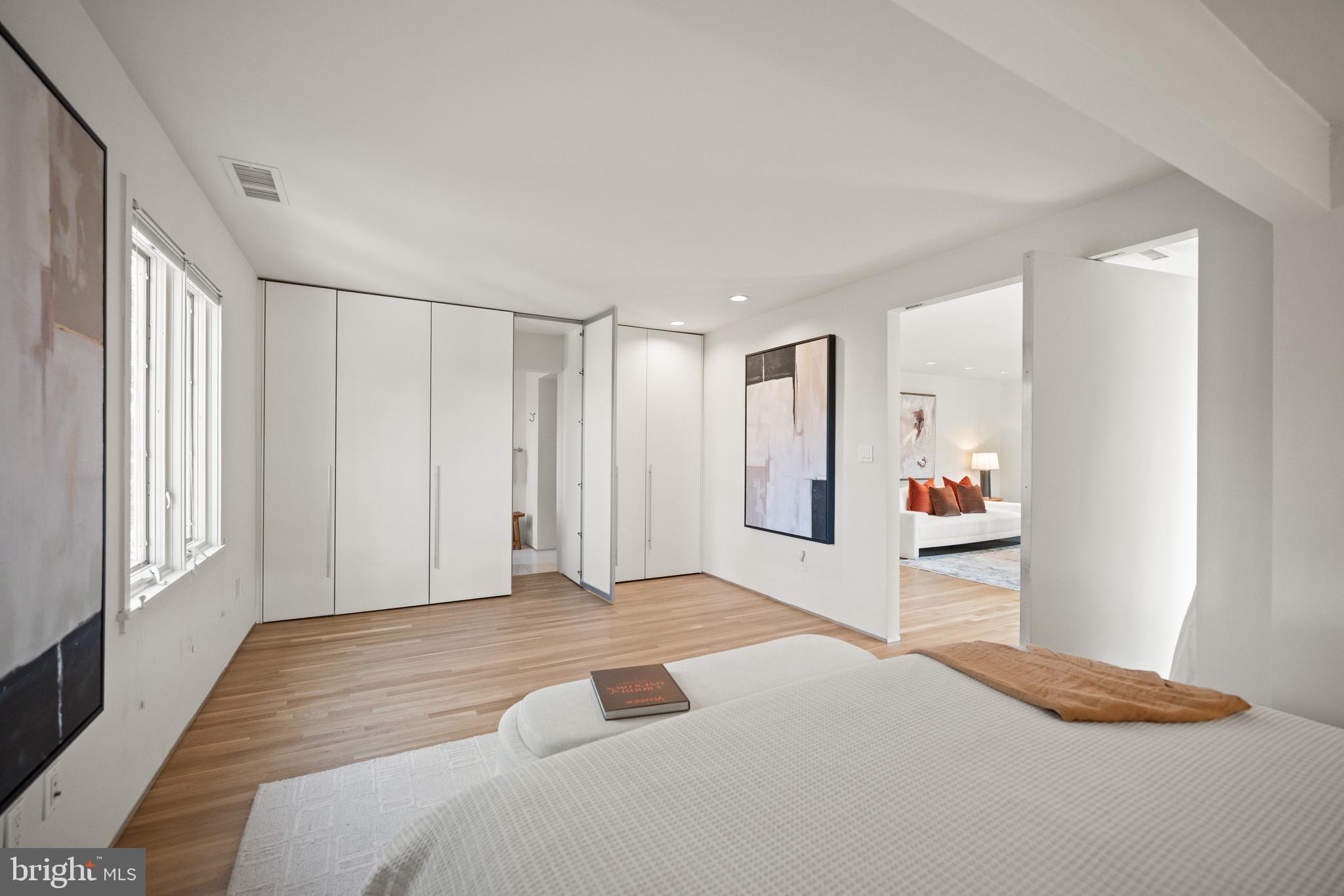 2319 Bancroft Place Northwest Washington, DC 20008 - Photo 23 of 37 a bedroom with a bed and a window
