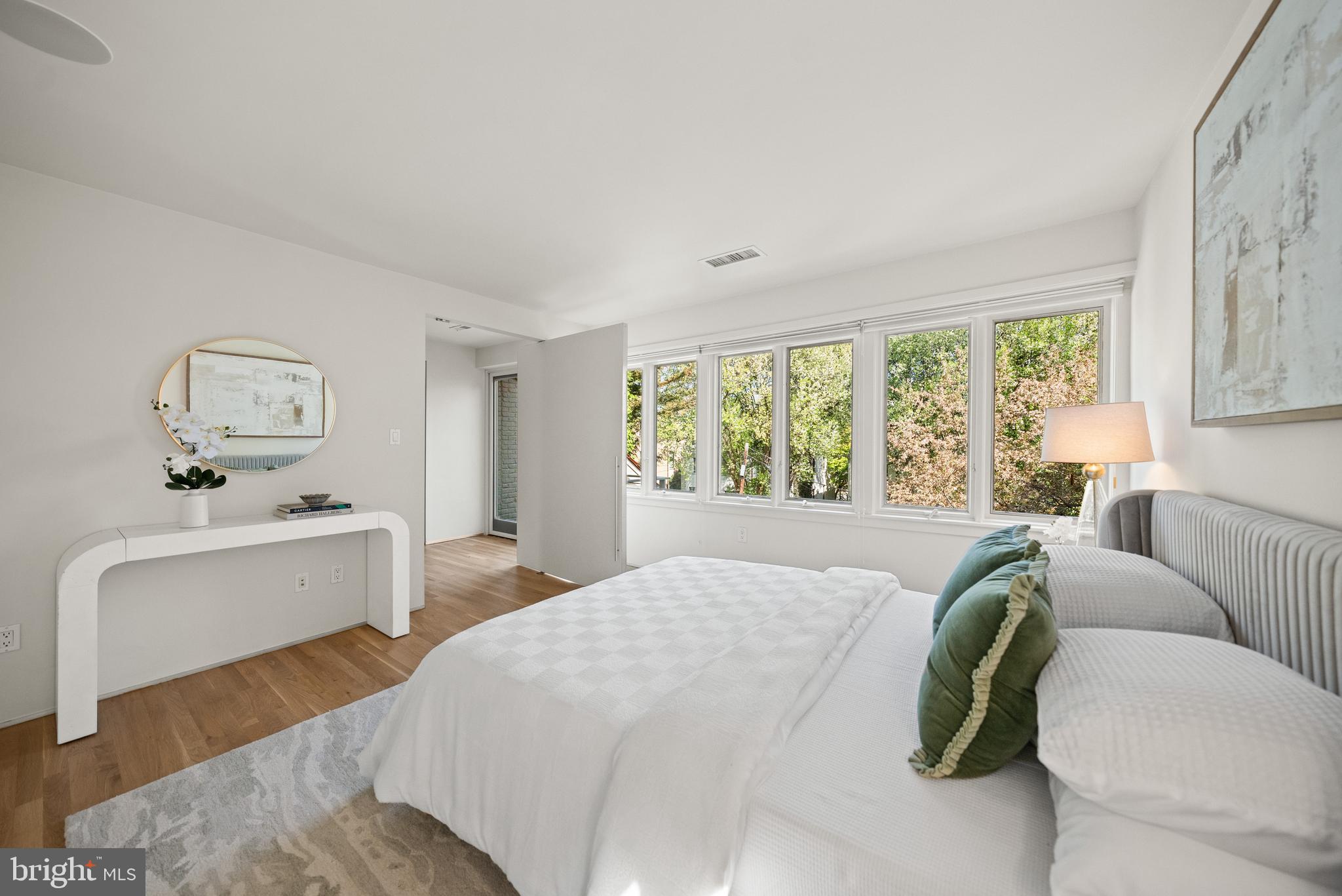 2319 Bancroft Place Northwest Washington, DC 20008 - Photo 25 of 37 a bedroom with a bed and wooden floor