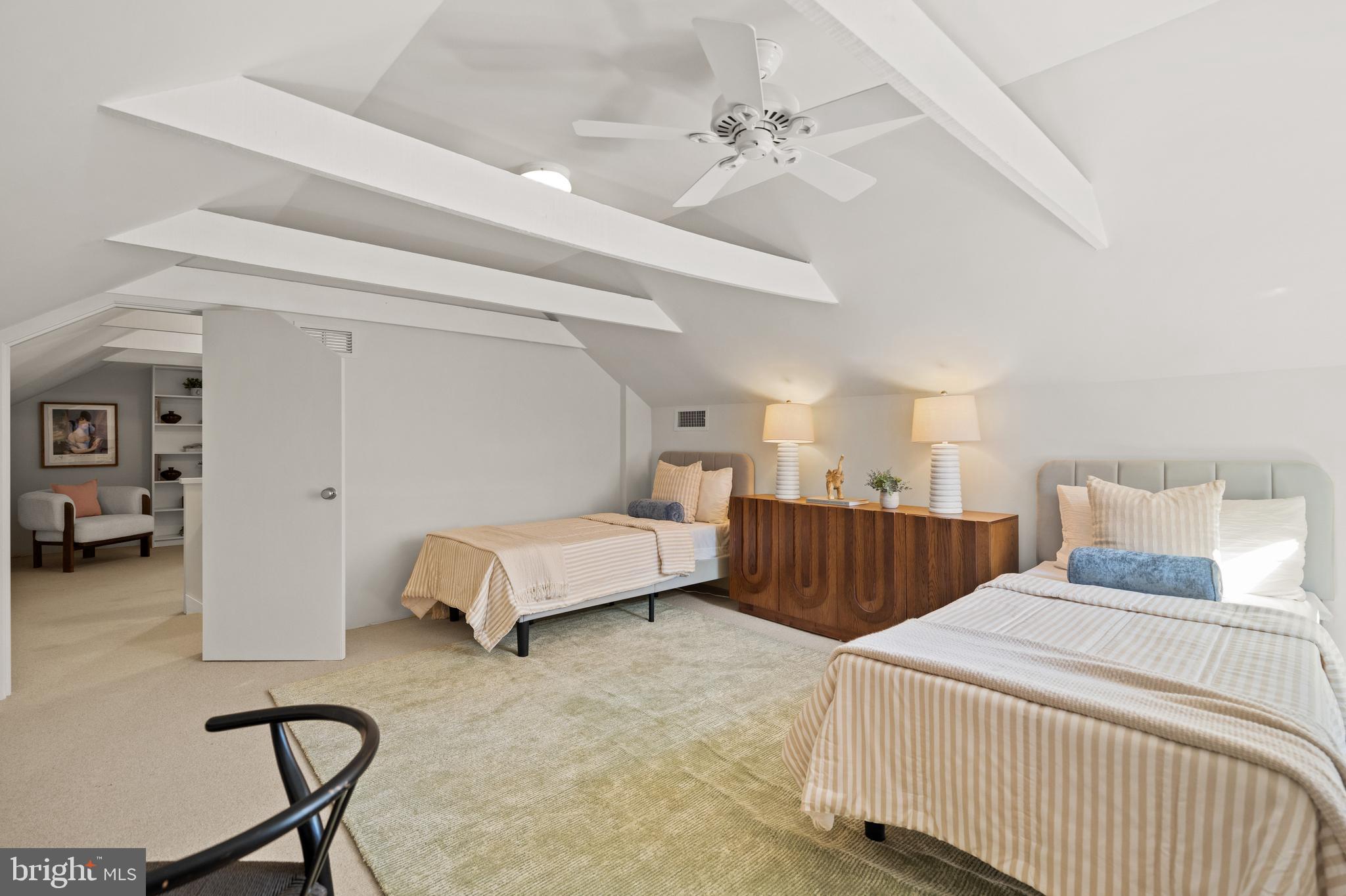 2319 Bancroft Place Northwest Washington, DC 20008 - Photo 30 of 37 a bedroom with a bed and a chair