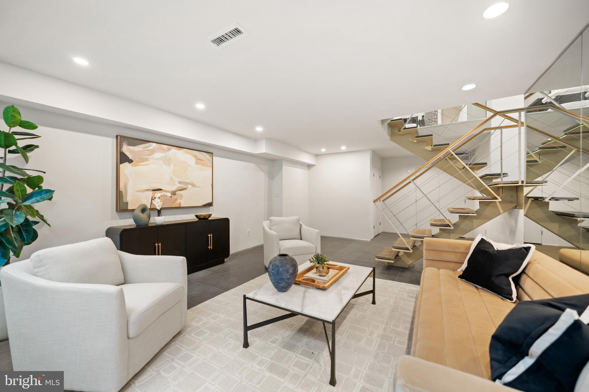 2319 Bancroft Place Northwest Washington, DC 20008 - Photo 32 of 37 a living room with a couch and a potted plant